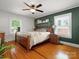 Spacious bedroom offers wood-frame bed, overhead ceiling fan, and well-lit interior at 512 Secrest Ave, Belmont, NC 28012
