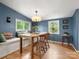 Charming dining room with hardwood floors, natural light, and a cozy built-in bench at 512 Secrest Ave, Belmont, NC 28012