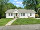 Charming single-story home with white siding, well-maintained lawn and inviting walkway at 512 Secrest Ave, Belmont, NC 28012