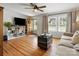 Inviting living room with hardwood floors, built-in shelving, and natural light streaming through the windows at 512 Secrest Ave, Belmont, NC 28012