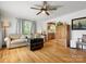 Cozy living room with hardwood floors, complemented by a sofa and a vintage steamer trunk at 512 Secrest Ave, Belmont, NC 28012