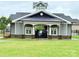 Community clubhouse featuring a stylish exterior and well-manicured lawn at 531 Cherry Blossom Nw Ave, Concord, NC 28027