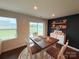Inviting dining area featuring a square table and large window, offering a bright and airy space for meals at 531 Cherry Blossom Nw Ave, Concord, NC 28027