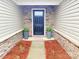 Inviting front entryway with decorative stone accents and welcoming doormat at 531 Cherry Blossom Nw Ave, Concord, NC 28027