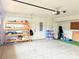 Large garage with storage shelves, offering ample space for vehicles and organization at 531 Cherry Blossom Nw Ave, Concord, NC 28027