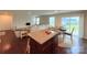Stylish open concept kitchen island with seating, flowing into living area at 531 Cherry Blossom Nw Ave, Concord, NC 28027