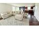 Open concept living room with a large comfortable sectional couch at 531 Cherry Blossom Nw Ave, Concord, NC 28027
