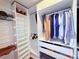 Well-organized walk-in closet featuring shelves, hanging rods, drawers, providing ample storage space at 531 Cherry Blossom Nw Ave, Concord, NC 28027