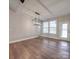 Dining area features hardwood floors, modern light fixture and entry to outside at 5604 Unionville Rd, Monroe, NC 28110