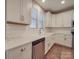 Bright kitchen features stainless steel appliances, white cabinetry and subway tile backsplash at 5604 Unionville Rd, Monroe, NC 28110