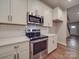 Bright kitchen features stainless steel appliances, white cabinetry and hardware at 5604 Unionville Rd, Monroe, NC 28110