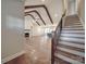 Open living area features hardwood floors, a fireplace, exposed ceiling beams and stairway at 5604 Unionville Rd, Monroe, NC 28110