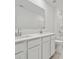 A clean bathroom featuring a double sink vanity, modern fixtures, and ample counter space at 561 Mountain View Dr, Monroe, NC 28110
