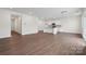 Bright living room featuring stylish wood flooring and easy access to the kitchen area at 561 Mountain View Dr, Monroe, NC 28110