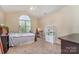 Bedroom with a vaulted ceiling, a bed in front of a window, and a desk in the corner at 591 Highland Ridge Rd, Mooresville, NC 28115