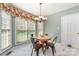 Breakfast nook with a round table, four chairs, and bright natural light at 591 Highland Ridge Rd, Mooresville, NC 28115