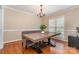 Traditional dining room with wood floors, chandelier, wainscoting, and lots of natural light at 591 Highland Ridge Rd, Mooresville, NC 28115