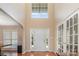 Bright foyer with hardwood floors, soaring ceilings, and a large window above the front door at 591 Highland Ridge Rd, Mooresville, NC 28115