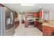 Well-equipped kitchen boasting stainless steel appliances, granite countertops, and tile flooring at 591 Highland Ridge Rd, Mooresville, NC 28115