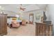 Bright main bedroom boasts a tray ceiling, two comfy pink chairs, and a large bed at 591 Highland Ridge Rd, Mooresville, NC 28115