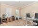 Comfortable home office with lots of natural light, neutral carpet, and light colored walls at 591 Highland Ridge Rd, Mooresville, NC 28115