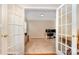 Bright home office with french doors, neutral walls, and modern desk at 591 Highland Ridge Rd, Mooresville, NC 28115