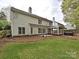 Rear exterior showcasing a pergola, patio and well-maintained lawn at 6112 Swanston Dr, Charlotte, NC 28269