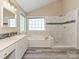 Gorgeous bathroom with double sink vanity, soaking tub and tiled walk in shower at 6112 Swanston Dr, Charlotte, NC 28269