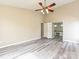 Large bedroom with luxury vinyl plank flooring, ceiling fan and en suite bathroom access at 6112 Swanston Dr, Charlotte, NC 28269
