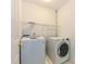 The laundry room with a side-by-side washer and dryer, with storage shelves at 6112 Swanston Dr, Charlotte, NC 28269