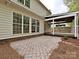 The backyard features a brick patio and a covered deck at 6112 Swanston Dr, Charlotte, NC 28269