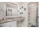 Bathroom featuring granite counters, large mirror, and a walk-in shower at 710 Anglin Forest Way, Charlotte, NC 28214