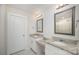 Bright bathroom with granite counters, dual sinks, decorative mirrors and white cabinetry at 710 Anglin Forest Way, Charlotte, NC 28214