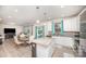 Open concept kitchen with island, granite countertops, stainless appliances, and ample cabinet space at 710 Anglin Forest Way, Charlotte, NC 28214