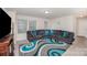 Spacious living room featuring a large sectional sofa and a stylish modern area rug at 710 Anglin Forest Way, Charlotte, NC 28214