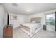 Cozy bedroom with neutral walls, carpet, a tufted headboard, and natural light from a window at 710 Anglin Forest Way, Charlotte, NC 28214