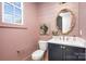 Stylish powder room features a marble countertop, unique mirror, and elegant fixtures at 728 Brookside Ave, Charlotte, NC 28203