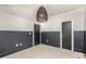 Bedroom with a neutral carpet, two-toned walls and a unique light fixture at 728 Brookside Ave, Charlotte, NC 28203