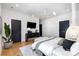 Bright bedroom with modern furnishings, herringbone floors, and stylish lighting at 728 Brookside Ave, Charlotte, NC 28203