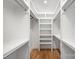 Walk-in closet featuring custom shelves, hanging rods and recessed lighting at 728 Brookside Ave, Charlotte, NC 28203