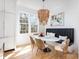 Bright dining area features an oval table, banquette seating, and eye-catching chandelier at 728 Brookside Ave, Charlotte, NC 28203