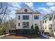 Beautiful white brick home boasts a stylish design with a round accent window at 728 Brookside Ave, Charlotte, NC 28203