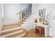 Stylish foyer with wooden floors, white walls, and staircase with unique iron railings at 728 Brookside Ave, Charlotte, NC 28203