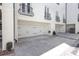 Spacious two-car garages showcasing white doors and exterior, complemented by wrought iron balconies above at 728 Brookside Ave, Charlotte, NC 28203