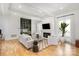 Bright living room featuring hardwood floors, fireplace, and a stylish green built-in bar area at 728 Brookside Ave, Charlotte, NC 28203