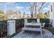 Charming outdoor patio area, furnished with a wooden table, bench, and chairs, perfect for relaxation at 728 Brookside Ave, Charlotte, NC 28203
