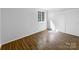 Bright bedroom featuring ample closet space, a large window, and laminate flooring at 7301 Pebblestone Dr # F, Charlotte, NC 28212