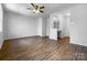 Large bedroom with laminate flooring, ceiling fan and separate vanity area at 7301 Pebblestone Dr # F, Charlotte, NC 28212