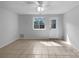 Versatile bonus room with tile flooring, a window, and access to the backyard at 7301 Pebblestone Dr # F, Charlotte, NC 28212