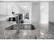 Updated kitchen featuring granite countertops, stainless steel appliances, and modern fixtures at 7301 Pebblestone Dr # F, Charlotte, NC 28212